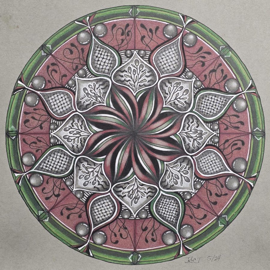Circular drawing with dusty rose panels, a green rim, and a red star center